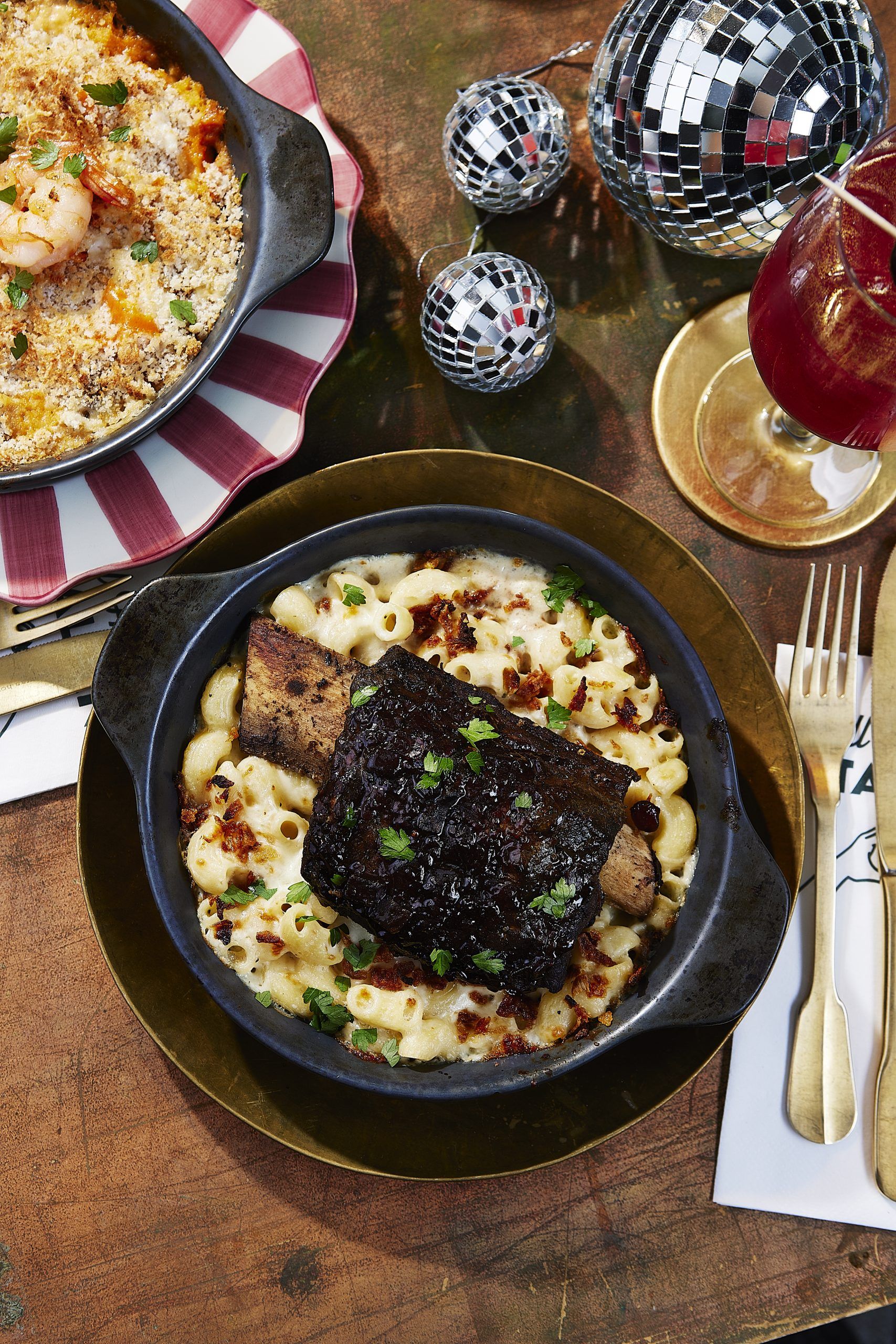 Sticky Beef Short Rib on a bed of creamy baked pasta in a cheese sauce. 